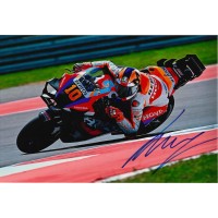 Autografo di Luca Marini in pista con moto Honda numero 10 in piega